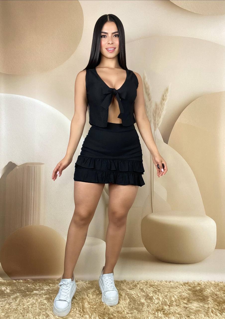 Conjunto falda con boleros y blusa moño